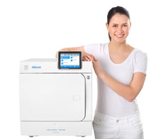 Melag autoclave 40B Evolution front view with woman stood to the side